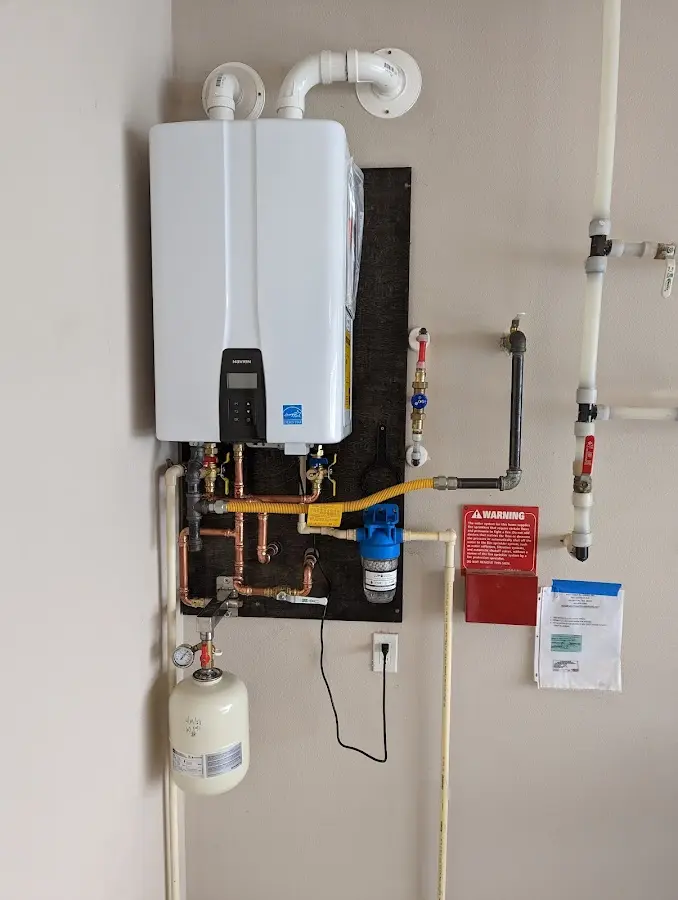 Professional plumber installing copper piping in a Palm Tree home